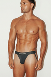 STRIKE PRO Core Cotton Jockstrap in Graphite grey, relaxed three-quarter front pose on model